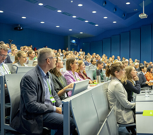 Lecture hall filled to a good capacity, participants follow the proceedings attentively.